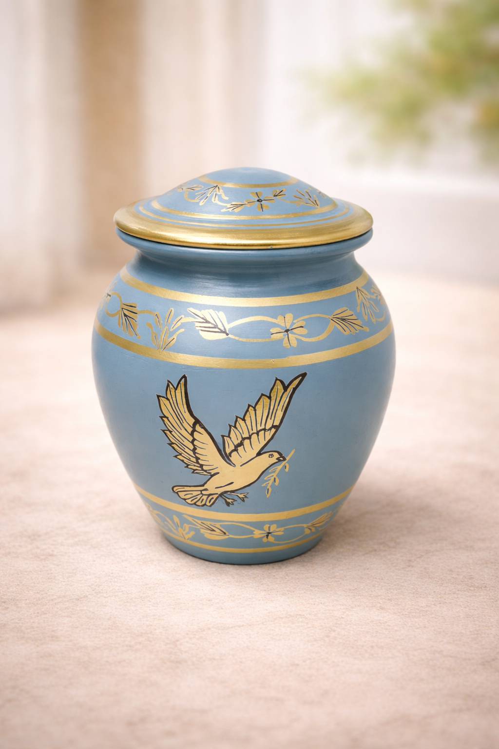 Elegant biodegradable cremation urn with peaceful dove design
