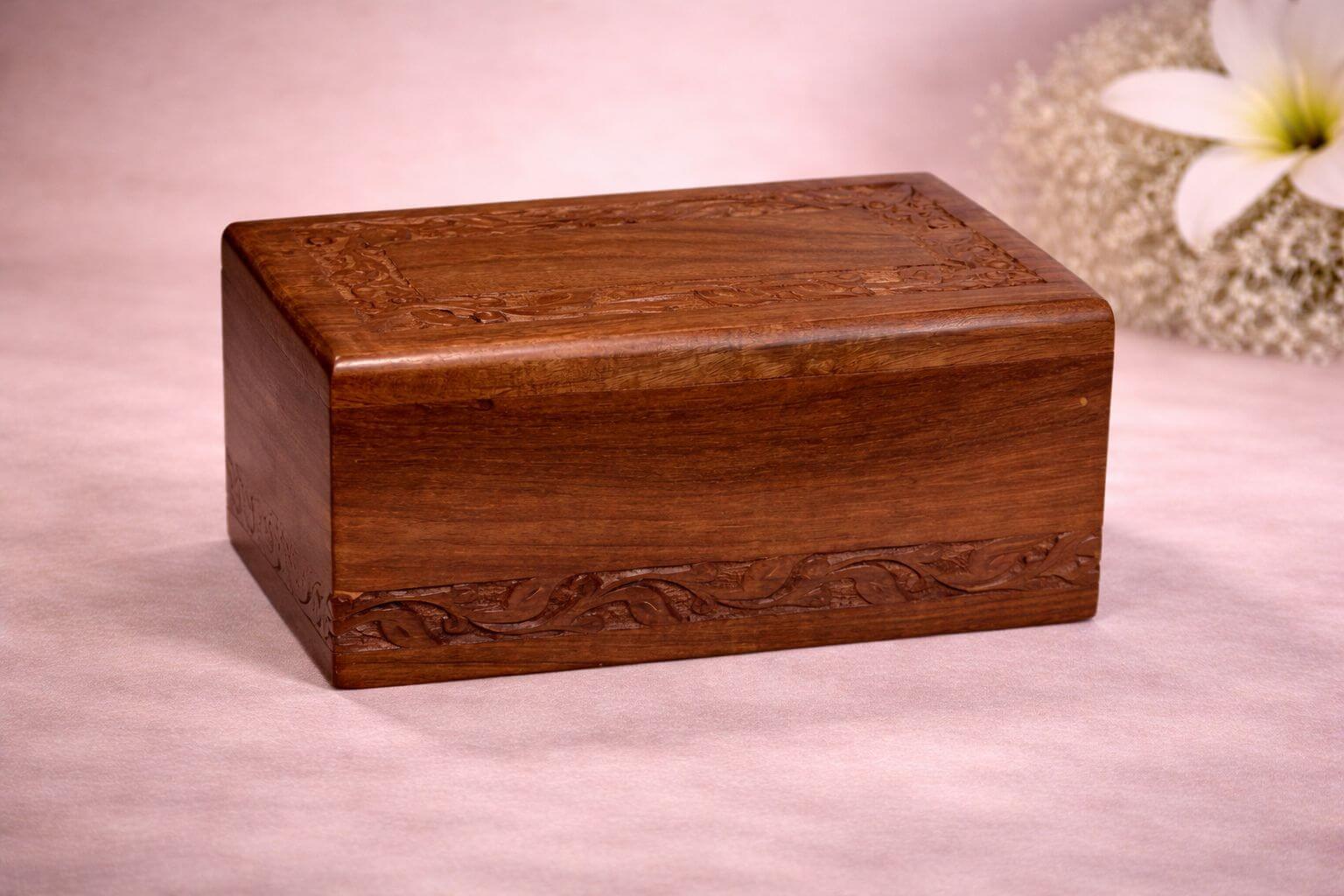 A premium handcrafted wooden pet urn with elegant carvings