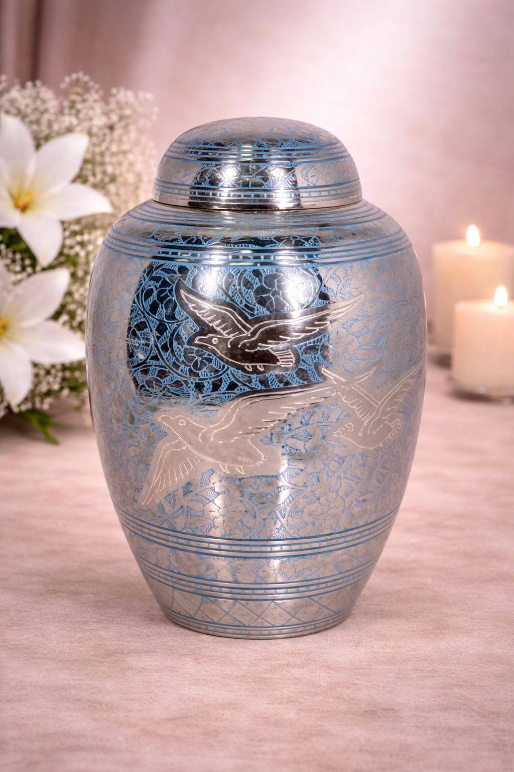 Elegant blue and silver brass adult urn with flying bird engraving